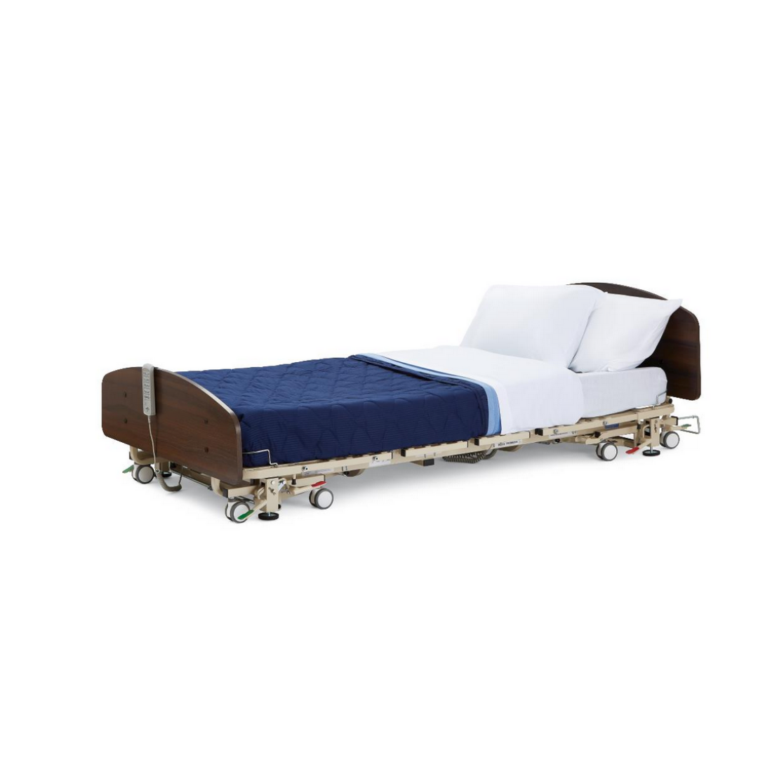 The Medline Alterra Maxx Long-Term Care Hi/Low Hospital Bed features a dark wood headboard and footboard, adjustable width and length, 5-function hand pendant, wheels, plus blue quilted blanket, white sheets, and pillows.